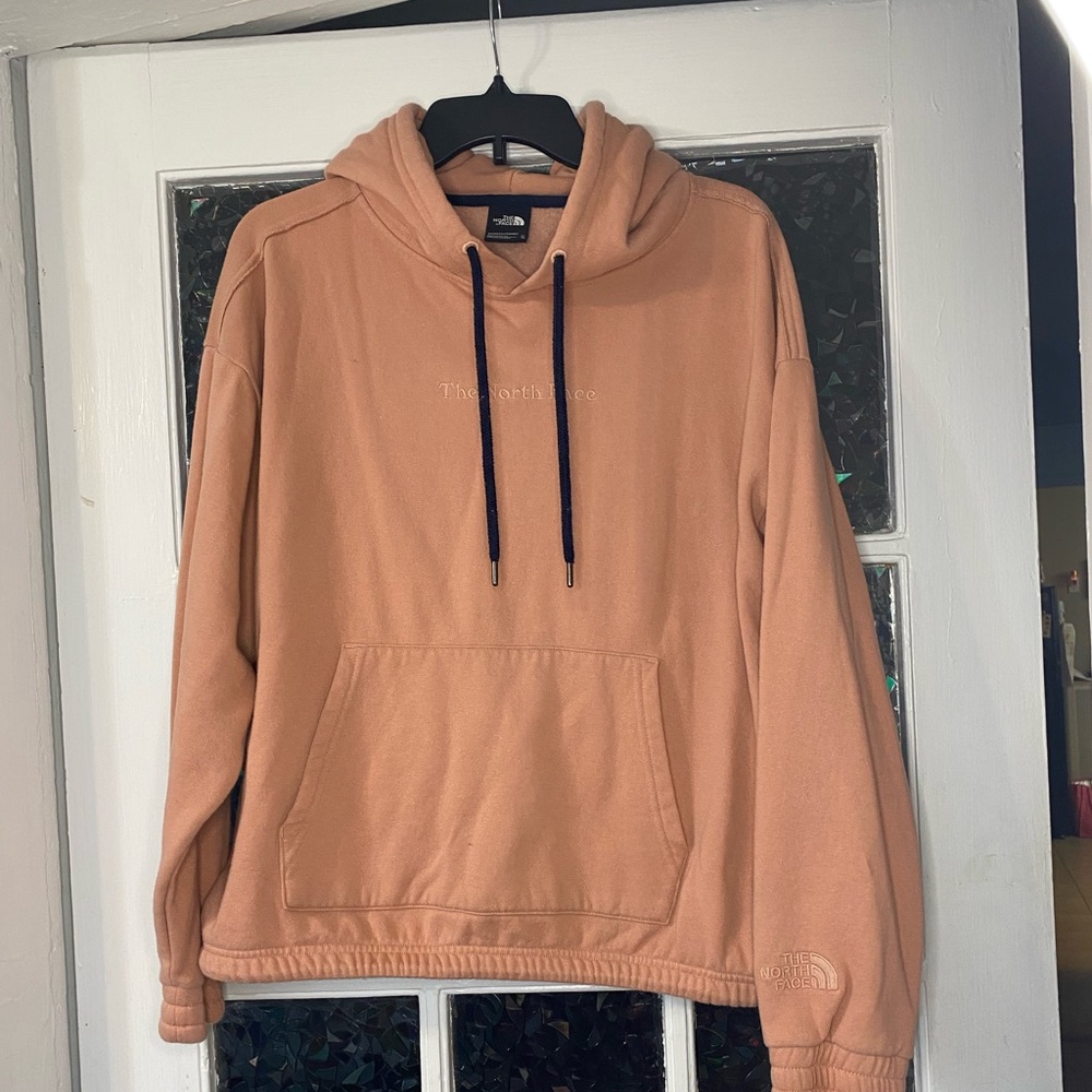 Gently worn North Face hoodie with an adjustable waistband